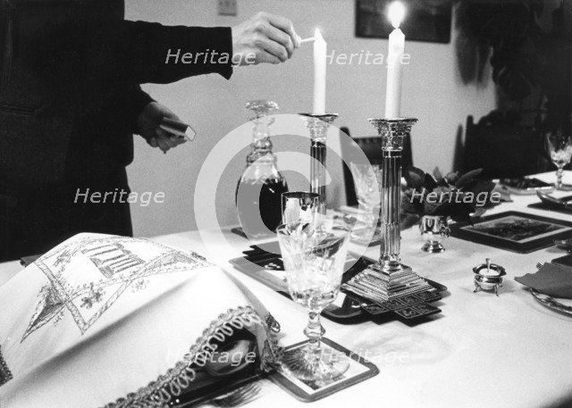 Lighting Shabbat candles, 1985. Artist: Unknown