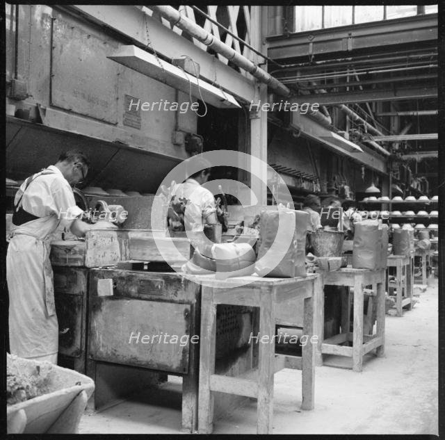 Operating jiggers in a pottery works, Stoke-on-Trent, 1965-1968. Creator: Eileen Deste.