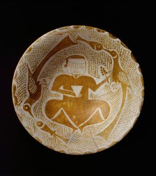 Bowl depicting a Man holding a Cup and a Flowering Branch, Iraq, 10th century. Creator: Unknown.