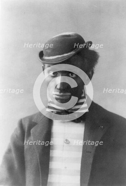 Man in blackface as minstrel, between c1890 and c1910. Creator: Frances Benjamin Johnston.