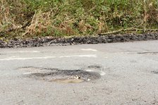 Pot holes in road surface 2017. Creator: Unknown.