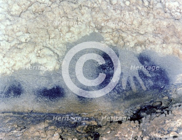 Panel of the points horses (Paintings Room, Pech-Merle Cave): detail of a hand in negative in bla…