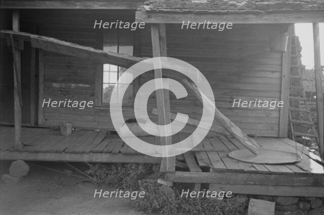 Porch of a sharecropper's cabin, Hale County, Alabama, 1936. Creator: Walker Evans.
