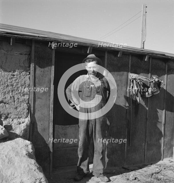 Mr. Roberts in front of his Owyhee project home, Malheur County, Oregon, 1939. Creator: Dorothea Lange.