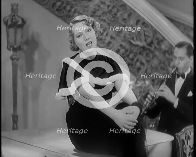 The Singer Elsie Carlisle and Her Band Performing a Song About Her Boyfriend Who Has Gone..., 1931. Creator: British Pathe Ltd.