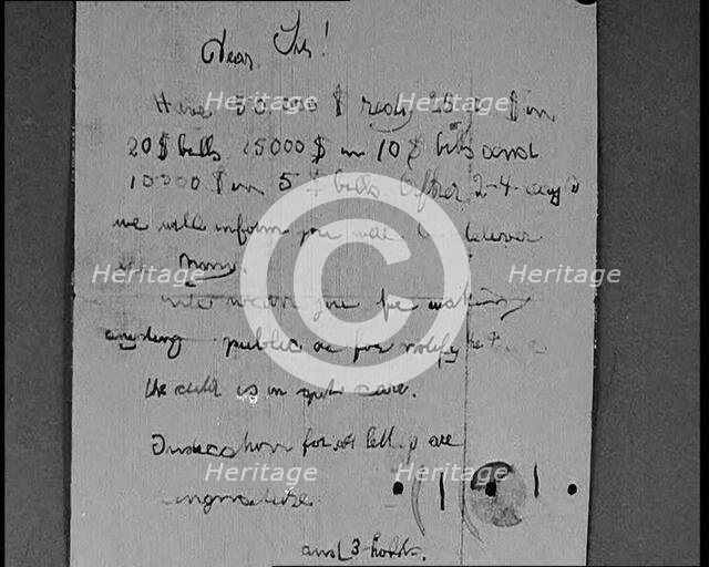 Notes of Ransom Being Shown as Articles of Evidence in the Lindbergh's Kidnapping Case Trial, 1930s. Creator: British Pathe Ltd.