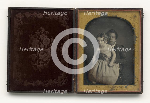 Daguerreotype of a boy holding a white baby, 1850s. Creator: Unknown.