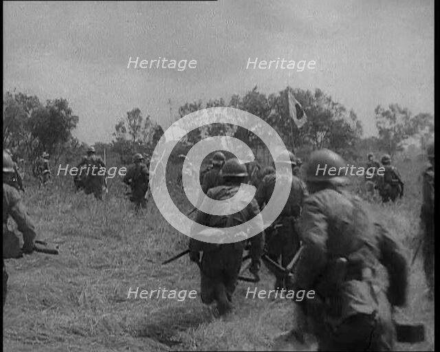 Japanese Soldiers Running Through a Field, 1933. Creator: British Pathe Ltd.
