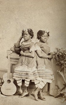 The Millie-Christine sisters, conjoined twins, standing, c1871. Creator: Unknown.