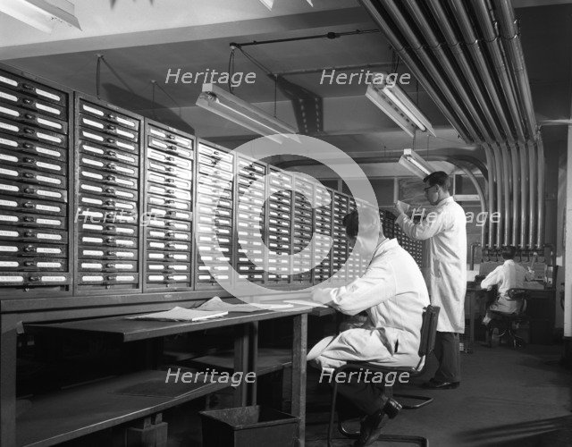 Pneumatic Tube Transport system at at Duckmanton Colliery stores near Chesterfield, 1962. Artist: Michael Walters