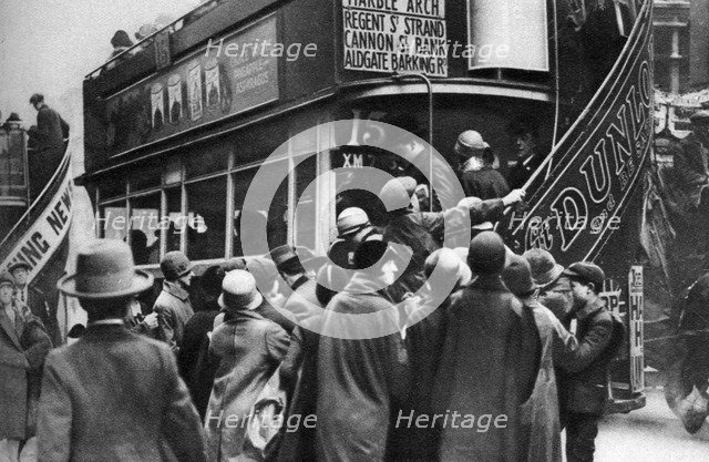 Getting on a bus in Ludgate Hill, London, 1926-1927. Artist: Unknown
