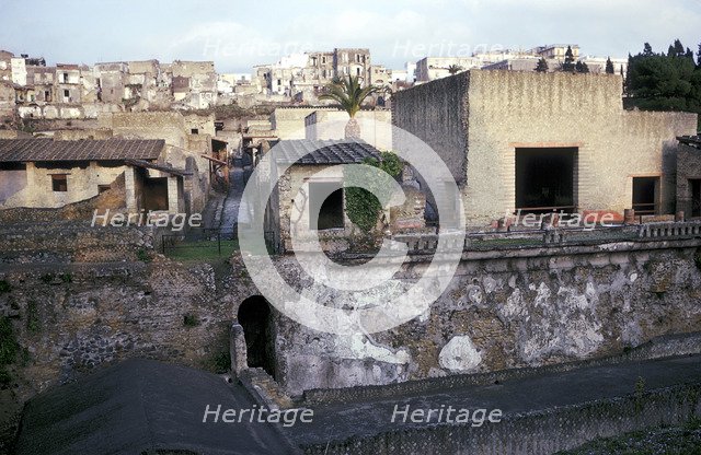 Buildings of Herculaneum with houses of the modern town of Ercolano above, Italy. Artist: Unknown