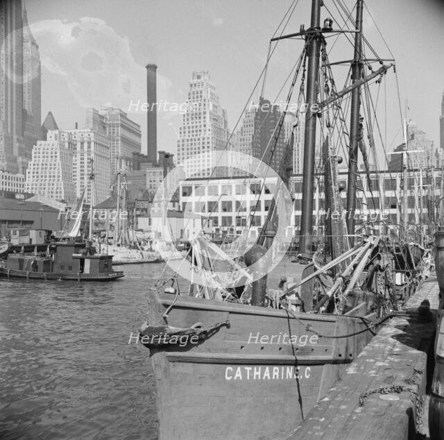 The New England fishing boat, the Catherine C, docked at the Fulton fish market, New York, 1943. Creator: Gordon Parks.