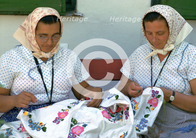 Two Hungarian women embroidering. Artist: CM Dixon Artist: Unknown