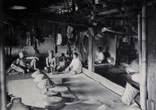 Sarawak: interior of a Kadayan tribal house, with a meal laid out, c1900. Creator: Unknown.