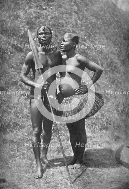 A Mulolo (Congo) warrior and his wife from the central Congo regions, 1902. Artist: Unknown.