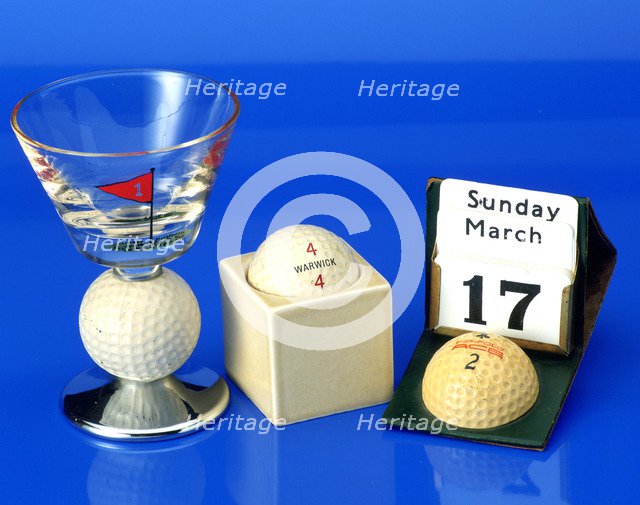 Hand-painted wine glass with golf ball,c1950; Advertising calendar with Penfold ball, c1930. Artist: Unknown
