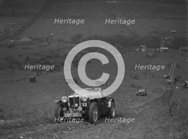 MG TA competing in the London Motor Club Coventry Cup Trial, Knatts Hill, Kent, 1938. Artist: Bill Brunell.