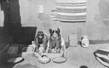 Hopi Indian women grinding corn meal, Walpi, Arizona, 1912. Artist: Robert Wilson Shufeldt.