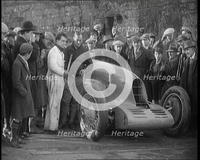 Malcolm Campbell Preparing his Car 'Bluebird' Watched By a Crowd of Civilians, 1927. Creator: British Pathe Ltd.