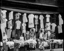 Street View of Street Market Selling Clothes in New York City, 1932. Creator: British Pathe Ltd.