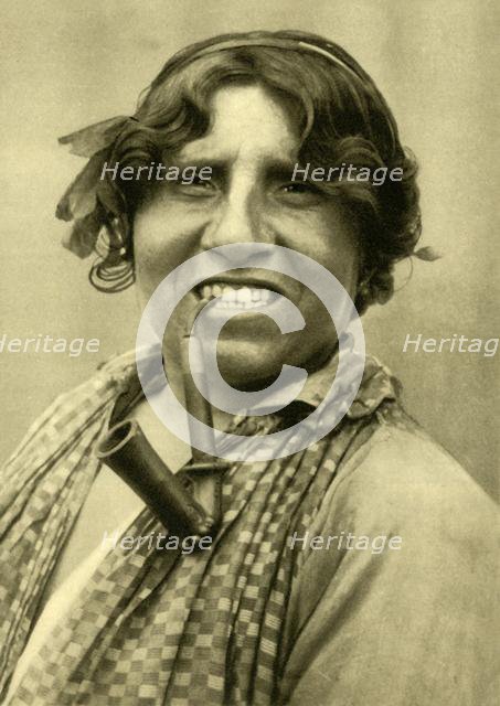 Gipsy woman smoking a pipe, Burgenland, Austria, c1935. Creator: Unknown.