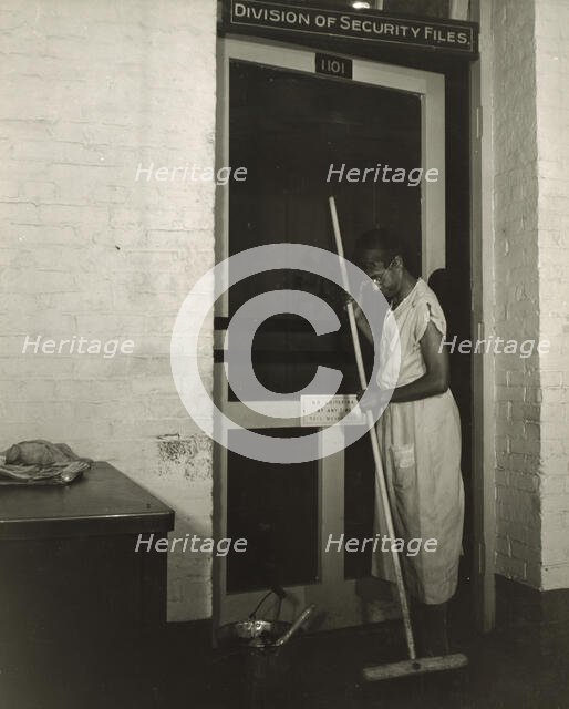 Government charwoman cleaning after regular working hours, Washington, D.C., 1942. Creator: Gordon Parks.
