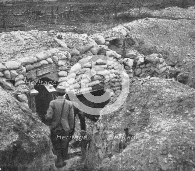 'Derriere L'ennemi refoule; Entrée d'un abri, dans une tranchee allemande ligne', 1915 (1924). Creator: Unknown.