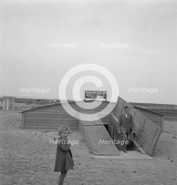 Congregation leaving after services, Dead Ox Flat, Oregon, 1939. Creator: Dorothea Lange.