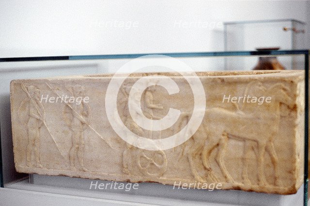 Greek warrior stepping into his chariot, c400 BC. Artist: Anon