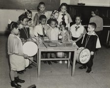 Drum students around a table, 1938. Creator: Andrew Herman.