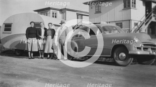 Car with caravan, Mooloolaba, Queensland, 1952. Creator: Jack Bain.