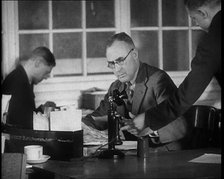 Journalist Being Handed Papers, 1933. Creator: British Pathe Ltd.