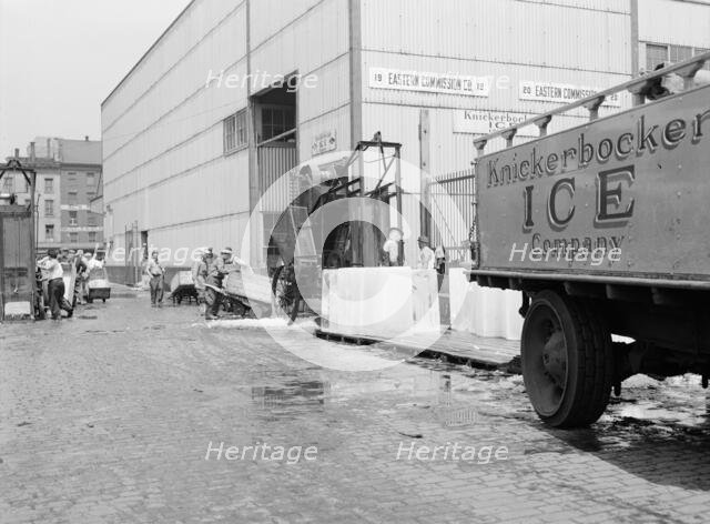 Ice which is used to store fish on boats that bring their catches into Fulton..., New York, 1943. Creator: Gordon Parks.