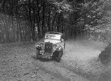 Singer coupe competing in the B&HMC Brighton-Beer Trial, Fingle Bridge Hill, Devon, 1934. Artist: Bill Brunell.