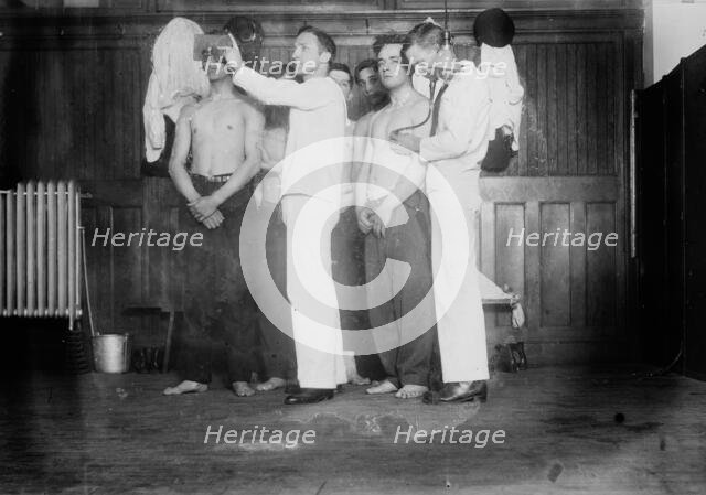 Examining new Navy Recruits, between c1910 and c1915. Creator: Bain News Service.